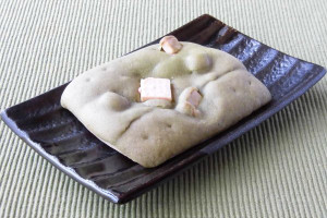 抹茶色のビス生地に覆われた、長方形の生地。